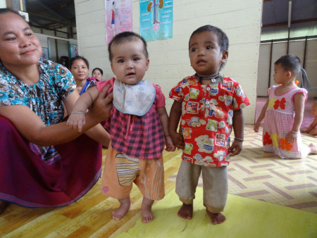 These children are a similar size despite the fact the baby on the left is six months old and the child on the right is two years old. Photo credit Dr Verena I Carrara