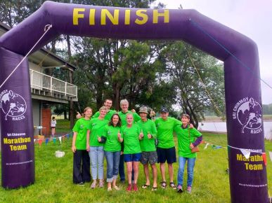 Members of the Dr RMF team gather at the finish line