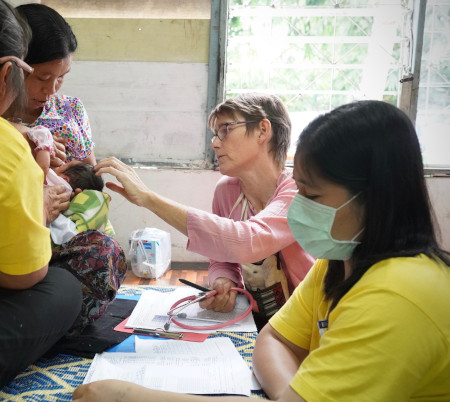 Dr Rose doing a ward round checking the newborn baby at Wang Pha clinic.